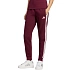 Dámske nohavice adidas Essentials 3-Stripes Fleece Slim v bordovej farbe KF8321